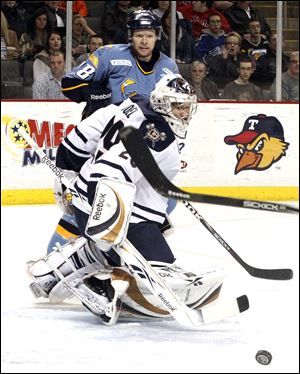 Toledo's Randy Rowe watches his shot deflect off of Nic Riopel and roll away at the Huntington Center. A capacity crowd of 8,000 watched the Walleye fall out of the final playoff spot.