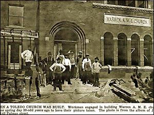 Workmen pause during construction of the church that was on Erie Street downtown. The congregation moved from it in 1950.