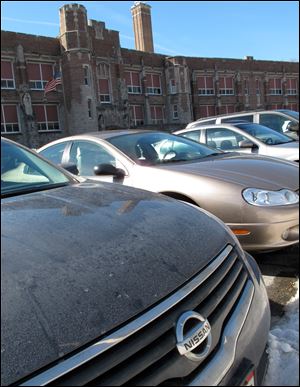 A Nissan is just one of the autos parked at Harvard Elementary.