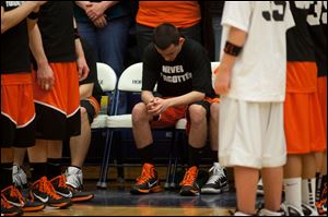 Fennville basketball player listens during the national anthem before their game state high school tournament against Lawrence Monday.