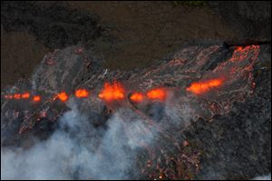 Lava flows on the Pu'u O'o crater on Kilauea Volcano on Sunday.