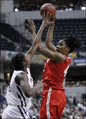 The Buckeyes' Jantel Lavender gets above Penn State defender Nikki Greene during Big Ten tournament action Sunday in Indianapolis. Lavender and teammate Samantha Prahalis each tallied 23 points as the Buckeyes won easily.