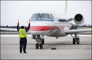 An American Eagle plane arrives at the Cherry Capital Airport, in Traverse City, Mich.
