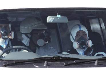 Japan-Aftermath-officers-masks-nuclear-plant