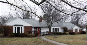 A foreclosed house on Christie Boulevard is being repaired and updated.