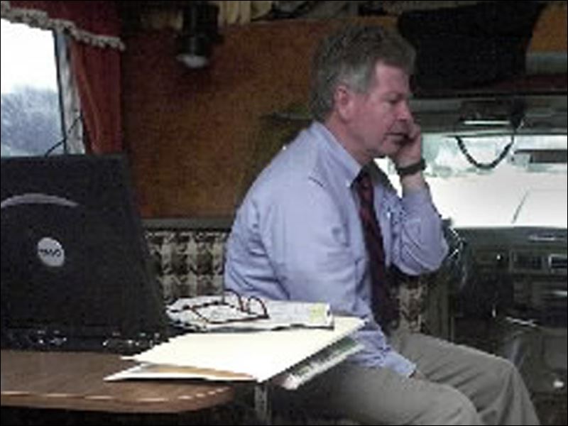 Rep. Rex Damschroder takes a phone call inside an RV he used for the ...