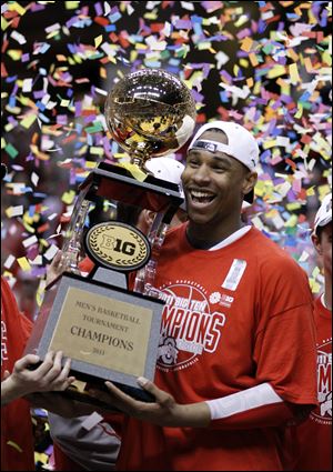 OSU's Jared Sullinger holds the Big Ten championship trophy after a 71-60 win over Penn State.
