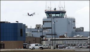 Delta Flight 3081 leaves Toledo Express Airport for Minneapolis, marking the airline's last flight from the airport. The 50-passenger twin-engine regional jet had 22 passengers, Delta reported.