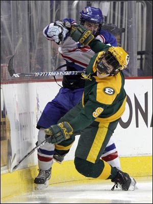 St. Francis' Ben Torchia checks Lakewood St. Edward's Nick Crosby in the third period.