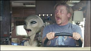 The alien Paul (voice of Seth Rogen) and his human friend Graeme (Simon Pegg) freak out at what's outside the window in the comedy-adventure 'Paul,' which is scheduled to open Friday.