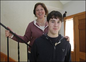 Christopher Drees, 16, a junior at Central Catholic High School, with his mother Suanne in their Toledo home, has had three concussions. The most recent, and debilitating, incurred during soccer practice last August.