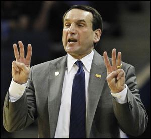 Duke veteran coach Mike Krzyzewski will take his first crack at career win No. 900 against Michigan in the NCAA tourney 3rd round.