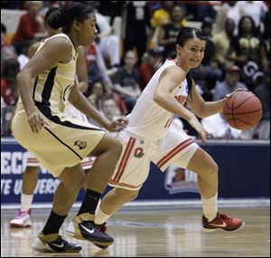 Ohio State's Samantha Prahalis, right, dribbles as Central Florida's Ashia Kelly defends during the second half.