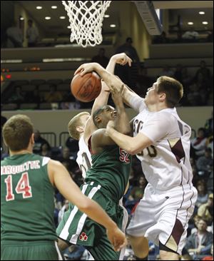 Central’s Keith Towbridge is fouled by Ryan Yurkschatt. 