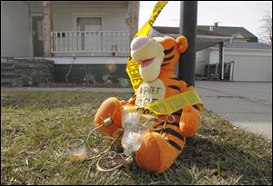 A stuffed animal still sits in the front yard of John Skelton’s house in Morenci, Mich., where the three little boys were last seen playing on Nov. 25.
