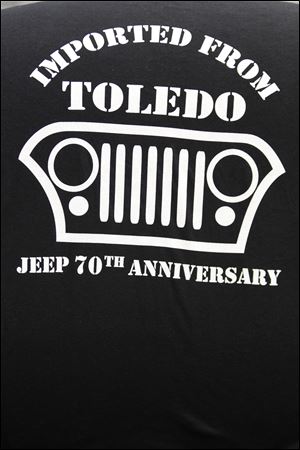 Mr. Mahalak's T-shirts play off Chrysler's ‘Imported from Detroit' ad line, introduced Feb. 6.