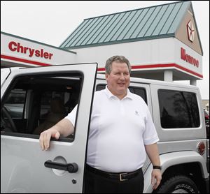 ‘I want to promote Toledo. I want to promote Jeeps,' says Ralph Mahalak, Jr., owner of Monroe Dodge Superstore. But Chrysler Group LLC has turned thumbs down on his ‘Imported from Toledo' T-shirts.