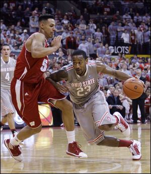 David Lighty tries to get past Wisconsin's Ryan Evans. Lighty averages 12.1 points per game for the 34-2 Buckeyes.