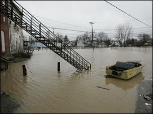 Flooding, such as this in 2008 in Findlay, is part of Ohio's losses, even though the risks are underwritten by the federal government.