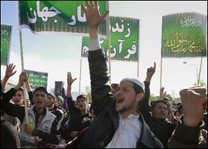 Afghans shout anti- U.S. slogans during a demonstration in Kabul, Afghanistan on Friday. Eight foreigners were killed on Friday after demonstrators protesting a reported burning of the Muslim holy book stormed a United Nations office.