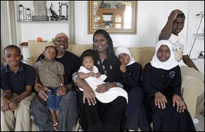 The family from left: Abdul Muhammad, Faheem Poole, Daniel Poole (father), Sakinah Muhammad, Tisha Ashar Poole, Taahirah Aminah Muhammad, Mecca Muhammad, and Elijah Muhammad.