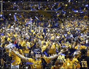 Blue and gold confetti rains down on a sea of gold T-shirts as the Rockets defeat USC at Savage Arena.