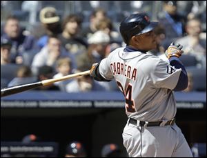 Detroit's Miguel Cabrera follows through on his third-inning, two-run home run, his second of the game, off New York starting pitcher Phil Hughes.