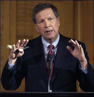 Gov. John Kasich proposes a $55.5 billion budget that includes a 50 percent cut in state payouts to local governments. He says it would close an estimated $7.7 billion gap.