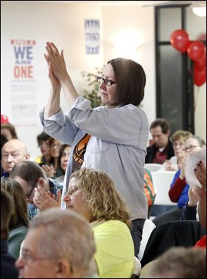 Darlene Blakely of Sylvania applauds for teachers’ rights at the UAW Local 14 hall during the ‘We Are One’ rally.