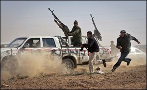 Libyan rebels use weapons attached to civilian vehicles to fight forces loyal to Libyan leader Moammar Gadhafi. A U.N.-mandated military intervention began March 19 to protect civilians. 