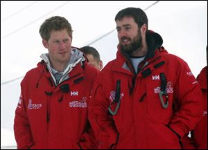 Prince Harry, left, arrives with Marti Hewitt as he joins the Walking with the Wounded team, on the island of Spitsbergen, situated between the Norwegian mainland and the North Pole.