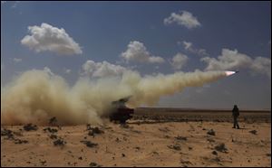 Rebels target positions held by Libyan leader Moammar Gadhafi's forces near the oil town of Brega.