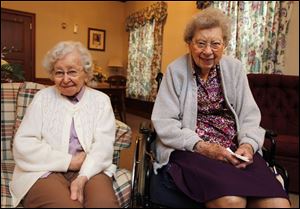 Irma Austin, left, who will be 100 on Sunday, and Esther Hoffman, whose 105th birthday is Wednesday, live at the Lutheran Home at Toledo. They both say they enjoy games.
