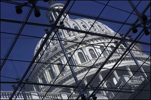 The Capitol dome is seen on Capitol Hill in Washington on Wednesday, as work intensifies in Congress to reach a deal on long-overdue legislation to finance the government through the end of September and avoid a government shutdown.