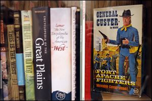 A book about Gen. George Armstrong Custer is one of many dedicated to local history in the library. He grew up in Monroe.