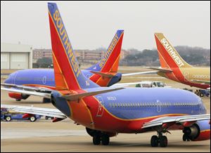 Southwest airplanes are seen at Love Field in Dallas in this 2008 file photo.