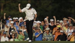 Rory McIlroy pumps his fist after making a birdie putt on the 17th hole during the third round of the Masters.