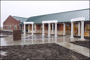 Seven pillars are part of a memorial plaza in front of the township's new administration building. 