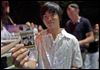  A Vietnamese student shows his checked ticket before entering the one-night-only show at RMIT University in Ho Chi Minh City.