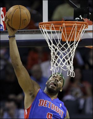 Detroit Pistons' Chris Wilcox goes in to dunk against Charlotte Bobcats.