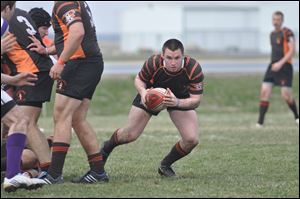 Perrysburg grad Ben Marshall bolts downfield for the BGSU rugby team.