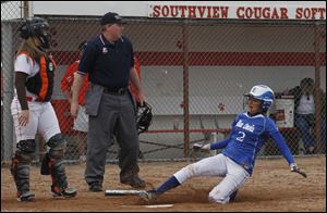 Southview catcher Jess Knepper can only watch as Chelsea Haas scores to give the Blue Devils a 3-1 lead in the seventh inning.