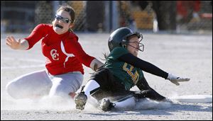 Clay's Danielle Holmes (2) is tagged out at second base by Central Catholic pitcher Erin Seiler (8) in Tuesday's City League softball game at Central Catholic.