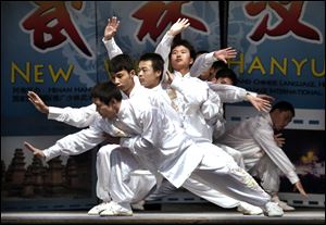 Performers from Songshan Shaolin Wushu Vocational Institute perform at Central Catholic High School.
