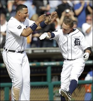 Detroit's Brandon Inge, right, celebrates hitting a walk off home run with Miguel Cabrera against Texas in the ninth inning.