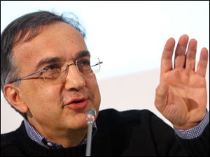 Fiat and Chrysler CEO Sergio Marchionne talks to journalists at the end of the March 20 shareholders meeting of Fiat Group at the Lingotto Fiat headquarters in Turin, Italy.