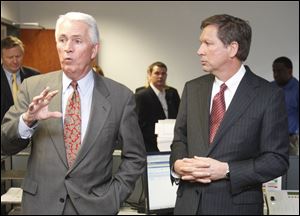 ODOT director Jerry Wray, left, says a lease of the Turnpike under Gov. Kasich's plan will be different than the lease of the Indiana Toll Road.