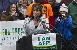 Former Alaska Gov. Sarah Palin speaks at a tax day tea party rally in Madison, Wis. 