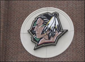 An NCAA executive says the university will face penalties for continuing to use its Fighting Sioux nickname and American Indian head logo. 