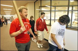 Mark Scoles, left, conducts a 